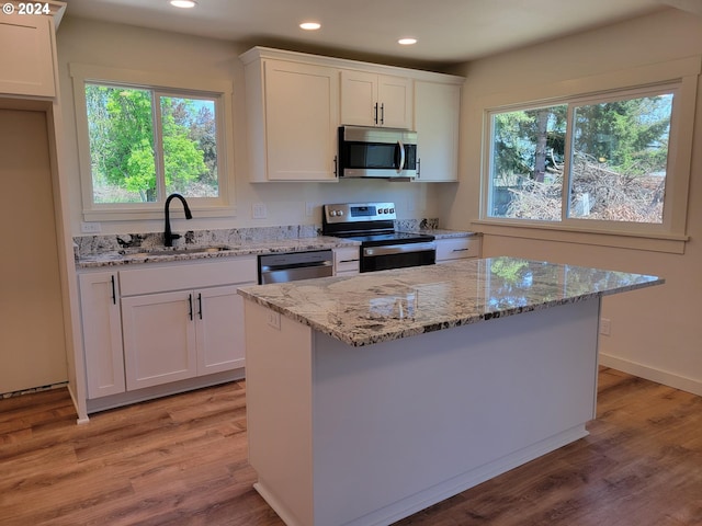 80 S 21st St, Saint Helens, OR 97051 - kitchen with stainless steel appliances, a sink, recessed lighting, white cabinetry, and healthy amount of natural light