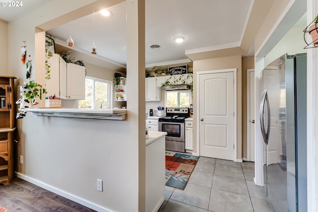 89329 Old Mohawk Rd, Springfield, OR 97478 - kitchen with stainless steel appliances, healthy amount of natural light, a peninsula, and white cabinetry