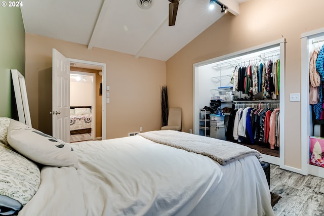 bedroom with vaulted ceiling with beams, light hardwood / wood-style floors, a closet, and ceiling fan