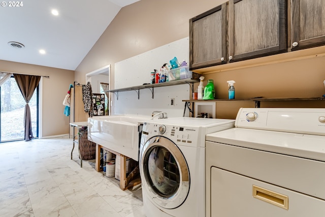 washroom featuring cabinets and independent washer and dryer