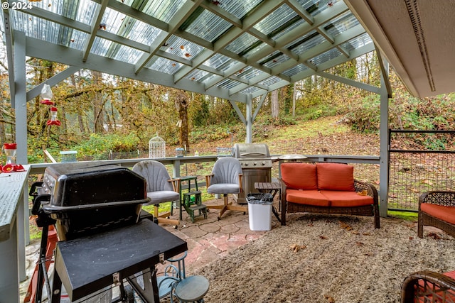 view of patio with a pergola and area for grilling