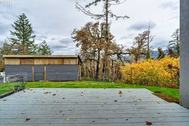 wooden deck with a yard