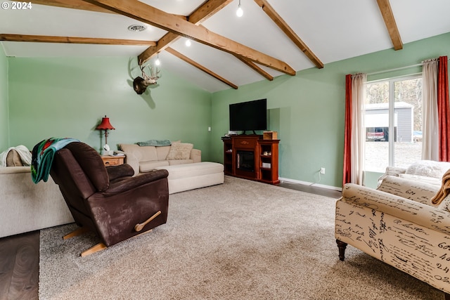 living room with beamed ceiling, carpet flooring, and high vaulted ceiling