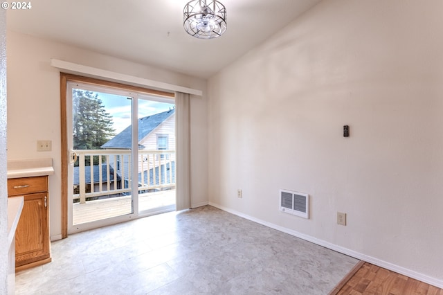 interior space with vaulted ceiling and an inviting chandelier