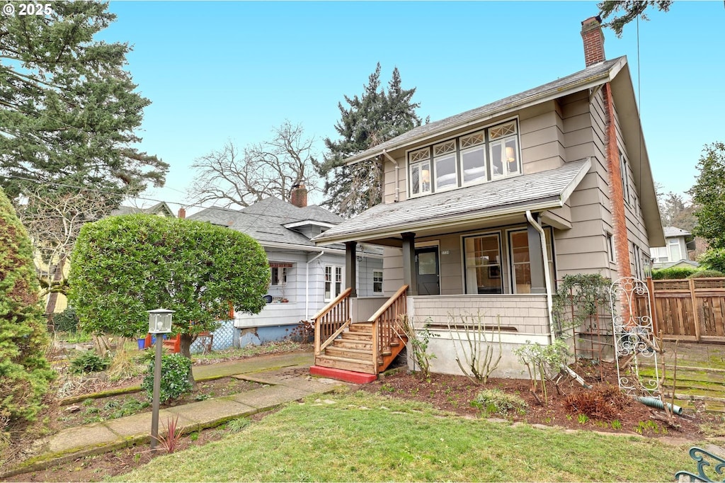 view of front of home featuring a front lawn and a porch