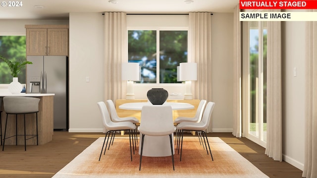 dining space with dark wood-type flooring