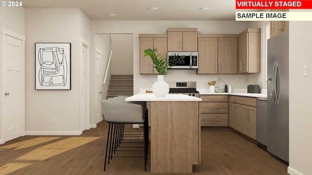 kitchen with stainless steel refrigerator with ice dispenser, stove, dark hardwood / wood-style flooring, and a center island