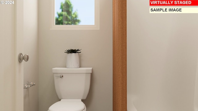 bathroom featuring toilet