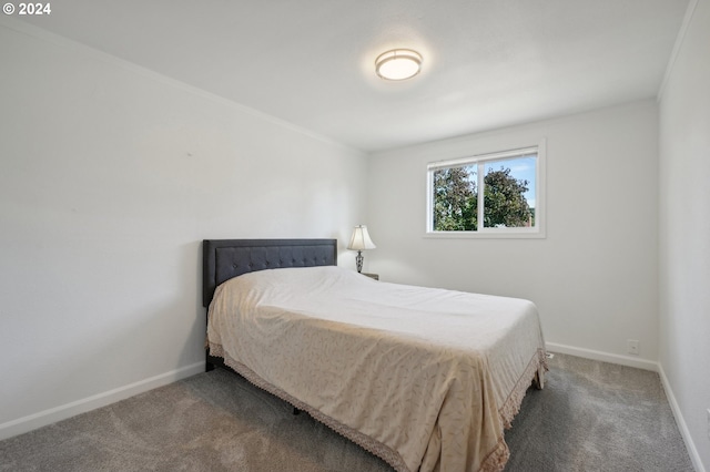 carpeted bedroom featuring ornamental molding