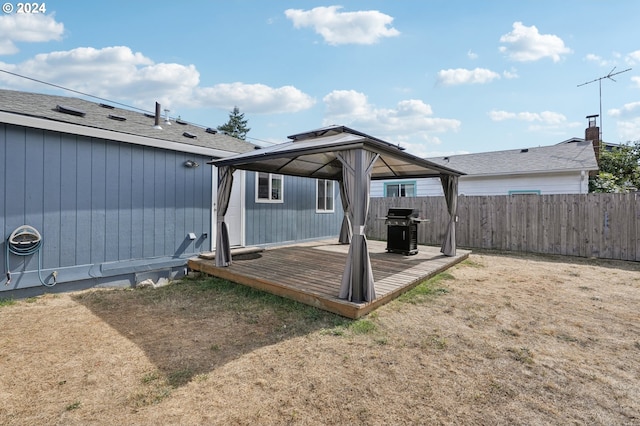 exterior space with a gazebo and a wooden deck