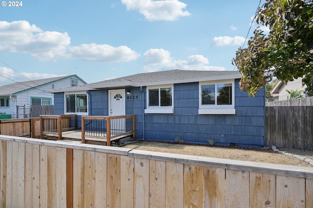 single story home featuring a deck