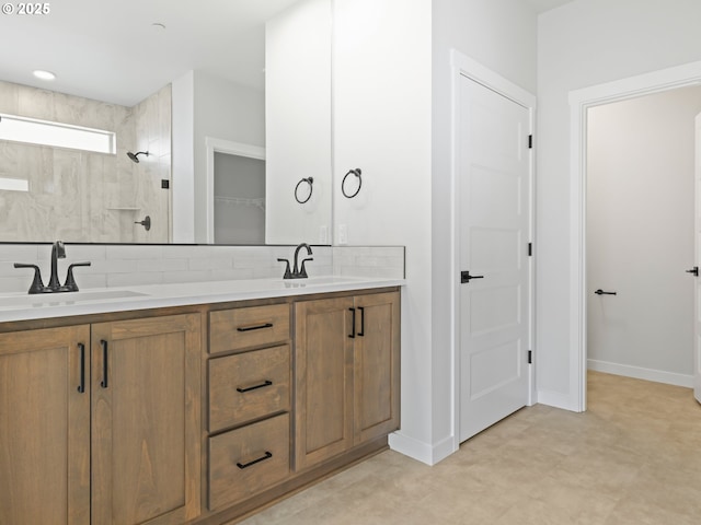 bathroom featuring decorative backsplash, walk in shower, and vanity