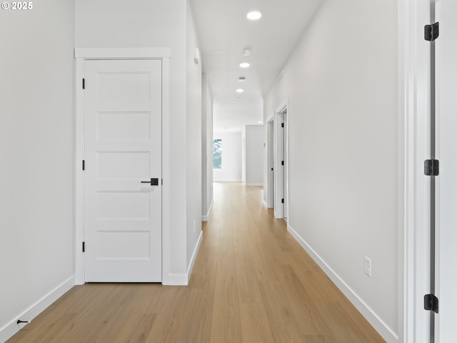 hall with light wood-type flooring