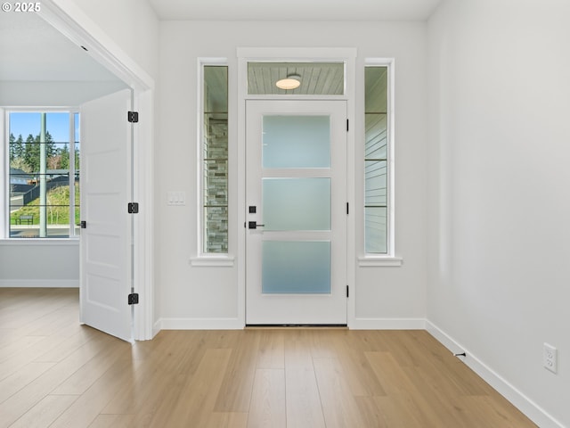 foyer entrance featuring light wood-type flooring