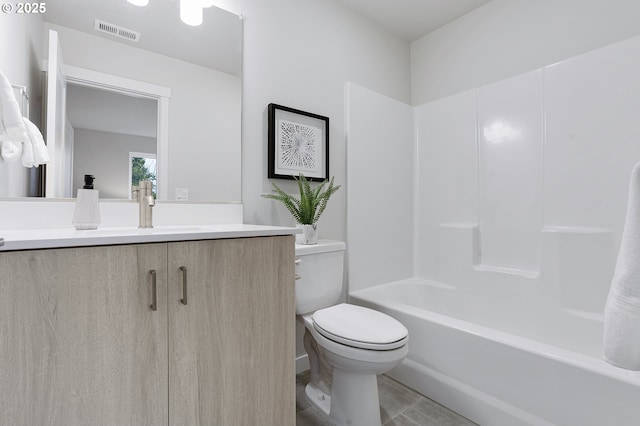 full bathroom with toilet, vanity, and bathing tub / shower combination