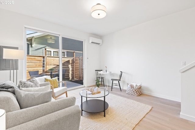 living room featuring hardwood / wood-style floors and an AC wall unit