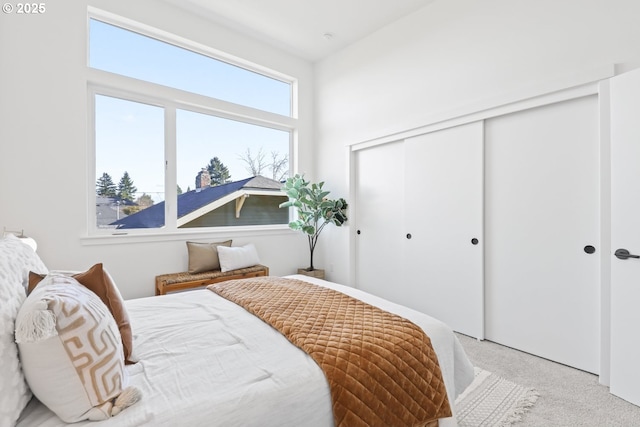 carpeted bedroom featuring a closet