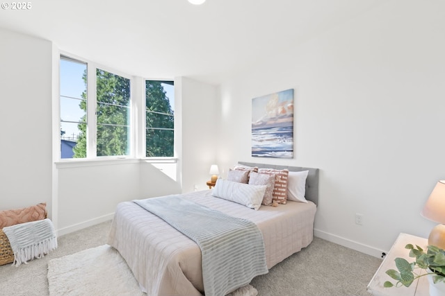 bedroom featuring light colored carpet