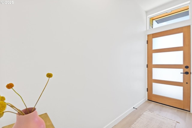 doorway to outside featuring light hardwood / wood-style floors