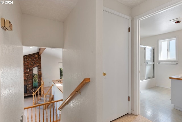 corridor featuring an upstairs landing