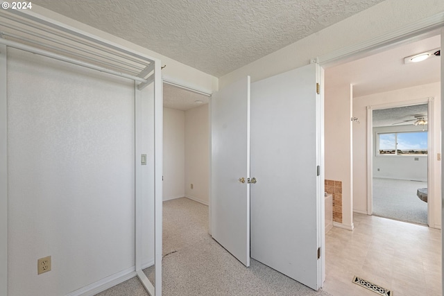 interior space with a textured ceiling