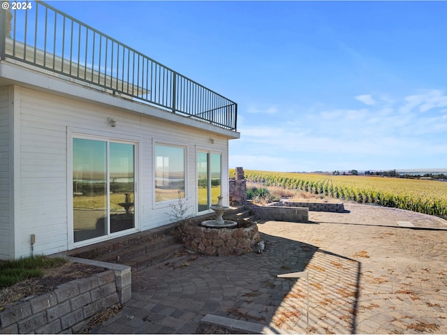 view of patio / terrace featuring a rural view
