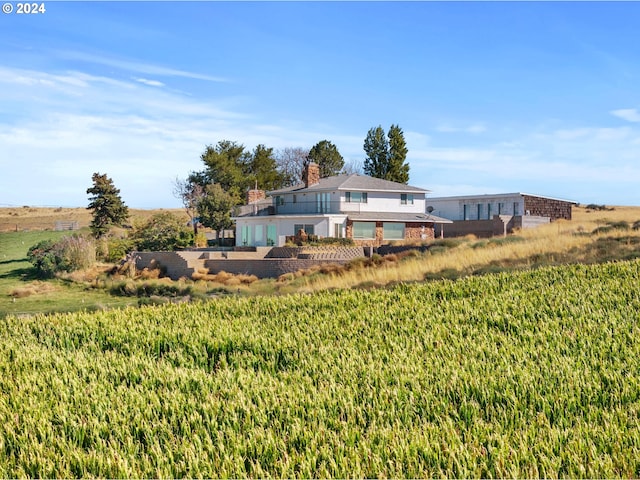 view of yard with a rural view