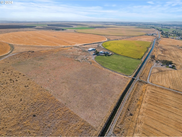 birds eye view of property featuring a rural view