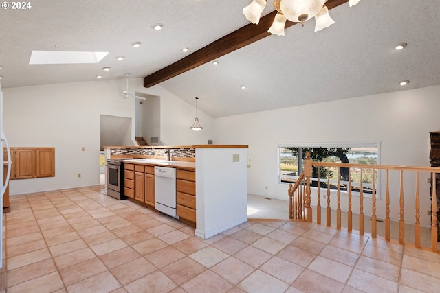 kitchen featuring stainless steel stove, beamed ceiling, light tile patterned floors, white dishwasher, and a skylight