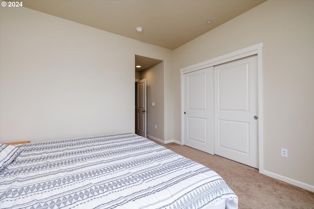 carpeted bedroom featuring a closet