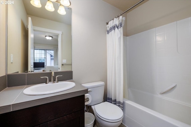 full bathroom with shower / bath combo, vanity, and toilet