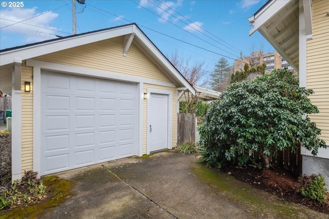 detached garage with concrete driveway