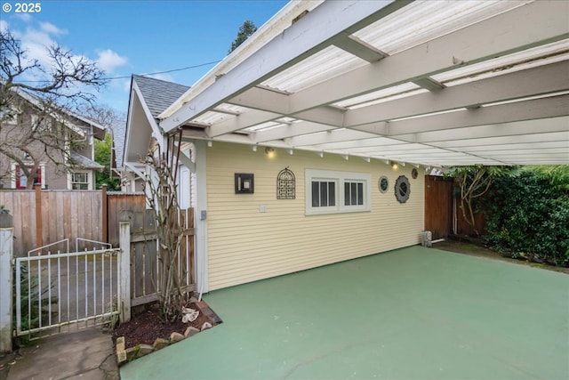 view of patio / terrace with fence and a pergola