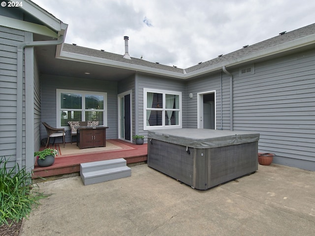 view of patio / terrace with a wooden deck and a hot tub