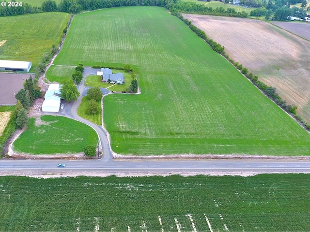 birds eye view of property featuring a rural view