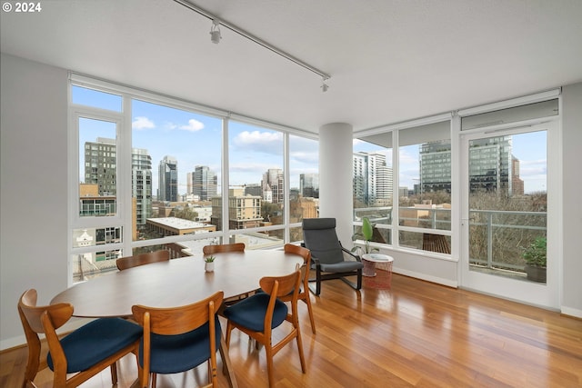 sunroom featuring a view of city