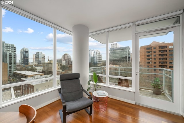 sunroom / solarium with a city view and plenty of natural light