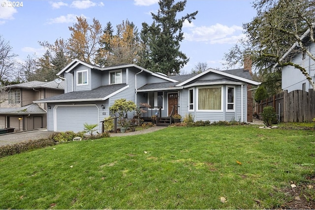 view of front facade with a front yard and a garage