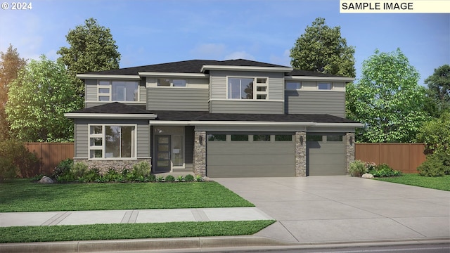 prairie-style home with a front yard and a garage