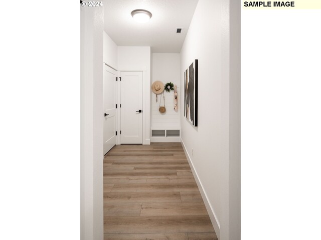 3600 N 11th Cir, Ridgefield, WA 98642 - hallway with light wood-style flooring and baseboards