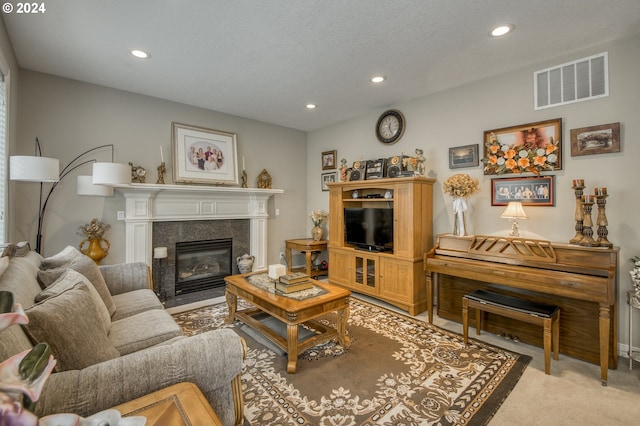 carpeted living room with a textured ceiling