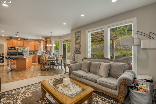 living room with a notable chandelier