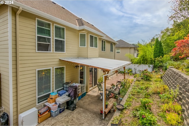 rear view of property featuring a patio