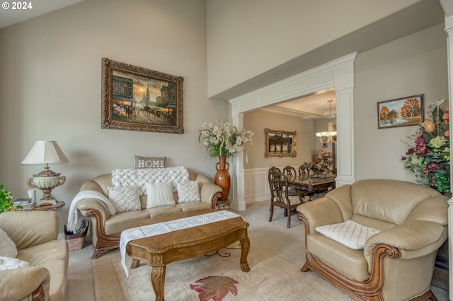 living room featuring light carpet and a chandelier