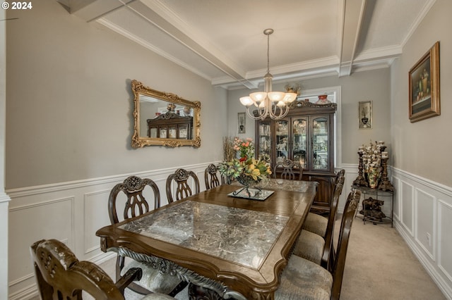 dining room featuring light colored carpet, a notable chandelier, beam ceiling, and ornamental molding