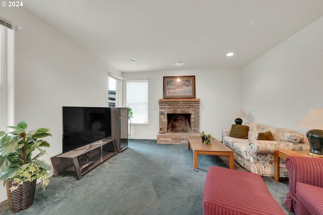 living room featuring carpet flooring and a fireplace