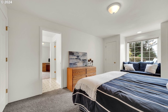 bedroom featuring light carpet