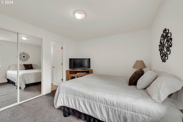 carpeted bedroom with a closet