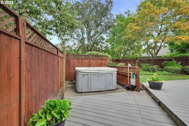 deck with a hot tub