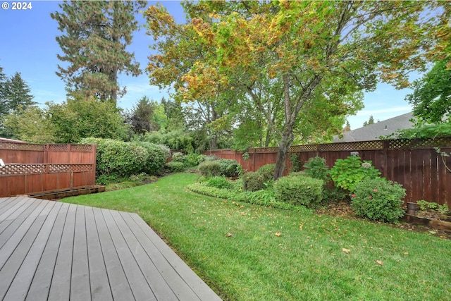 view of yard featuring a wooden deck